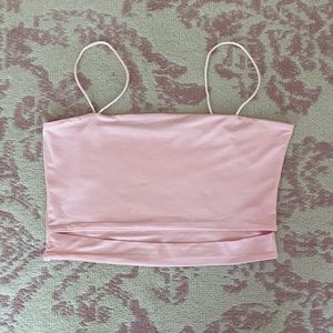 Light pink crop top with slit on bottom.